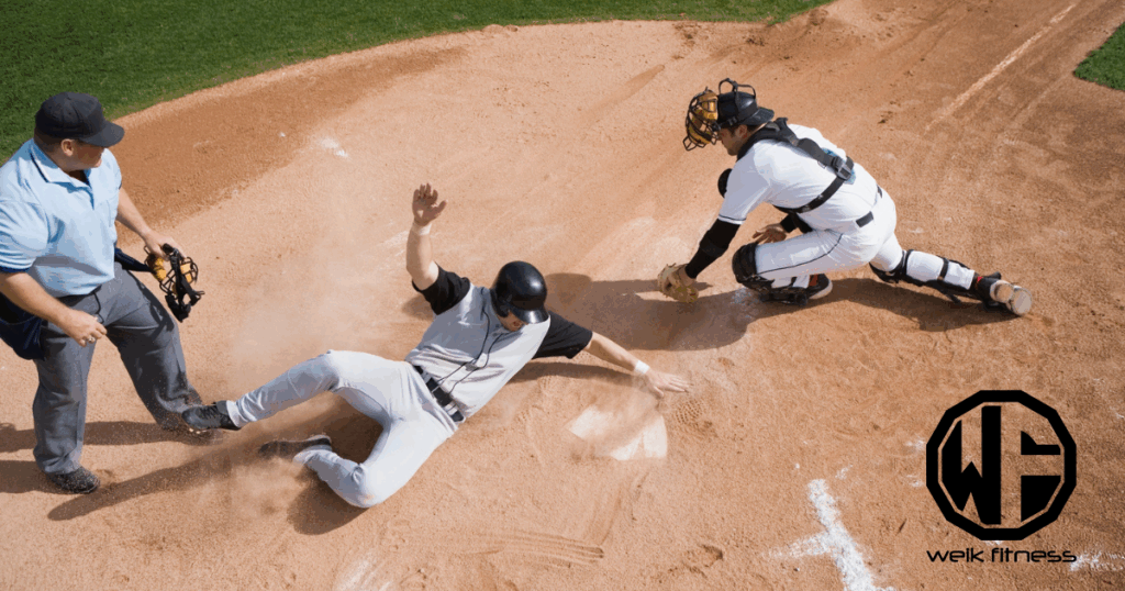 baseball player sliding into home