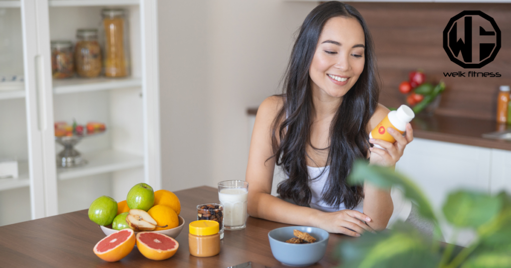 woman looking at supplement